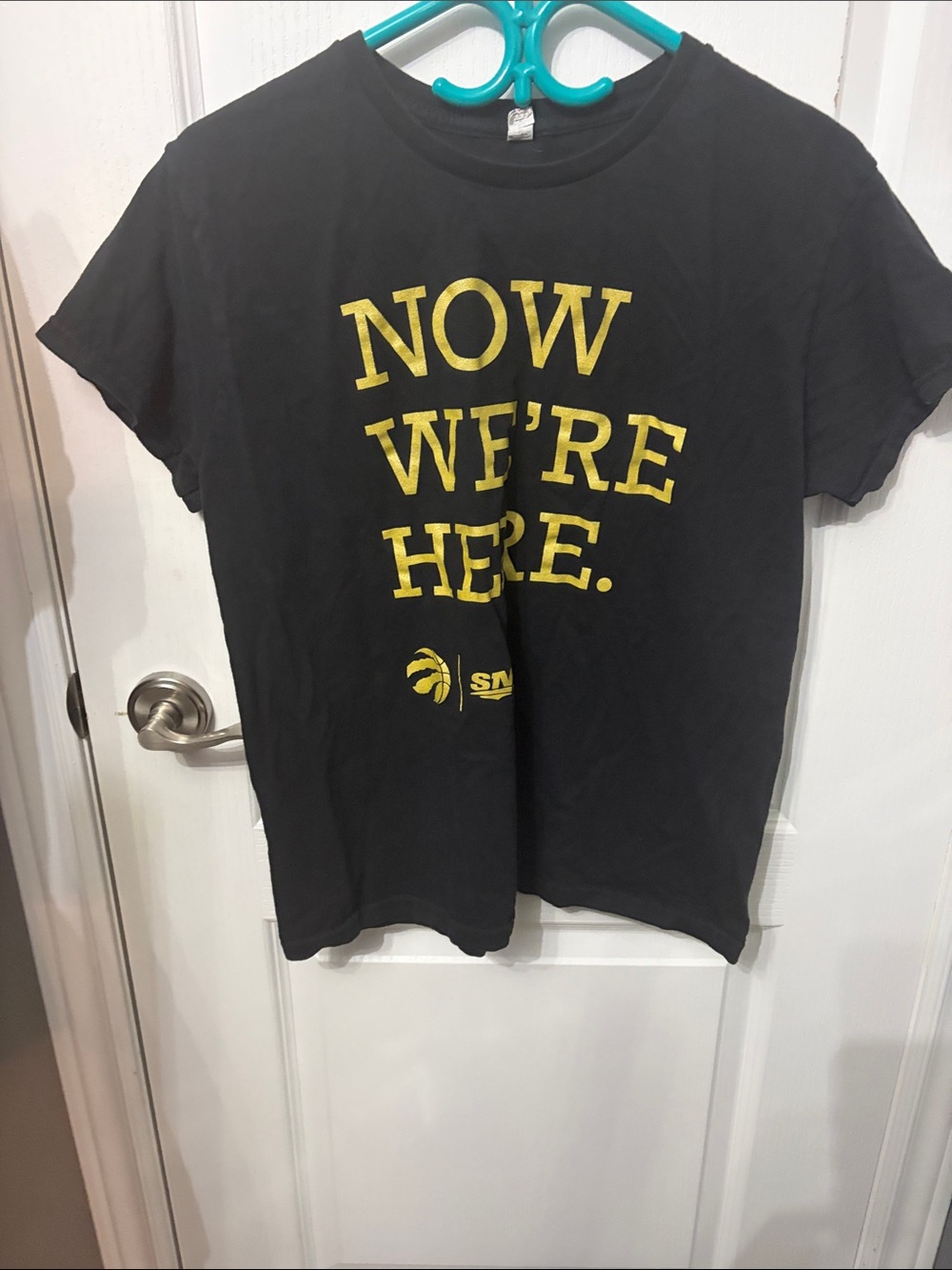 Black Short Sleeve Tee with Gold 'NOW WE'RE HERE.' Graphic